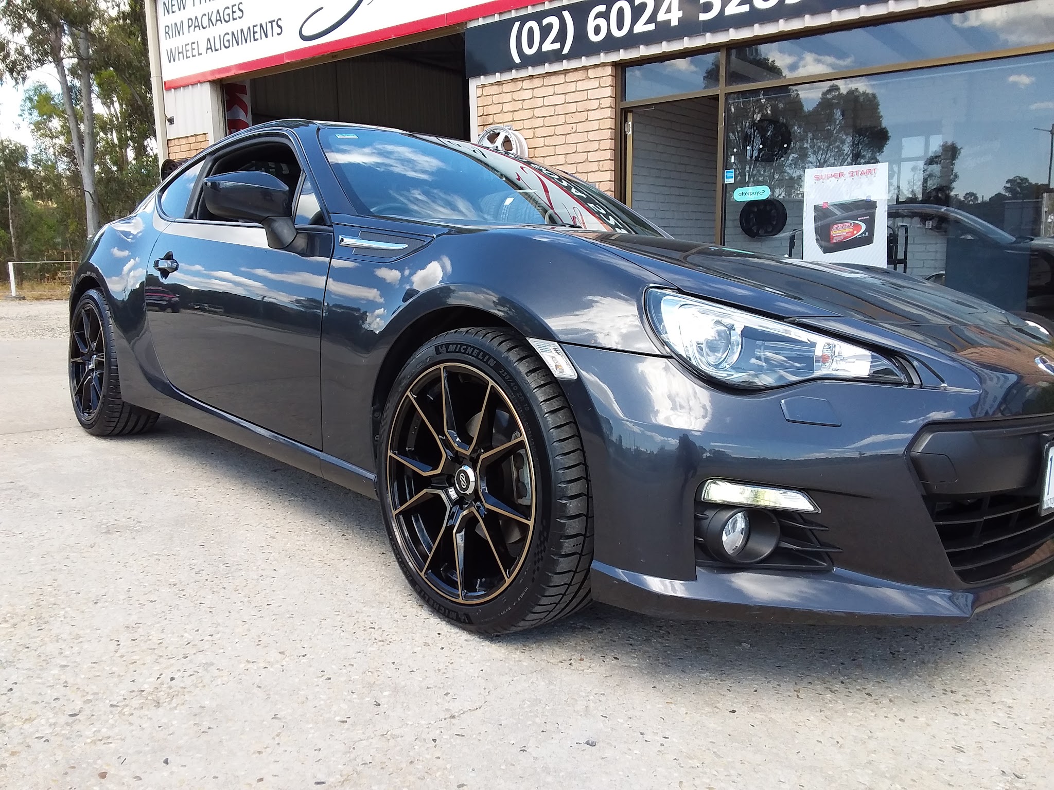 Subaru BRZ on black and bronze alloy wheels at the Sunday Tyres shopfront