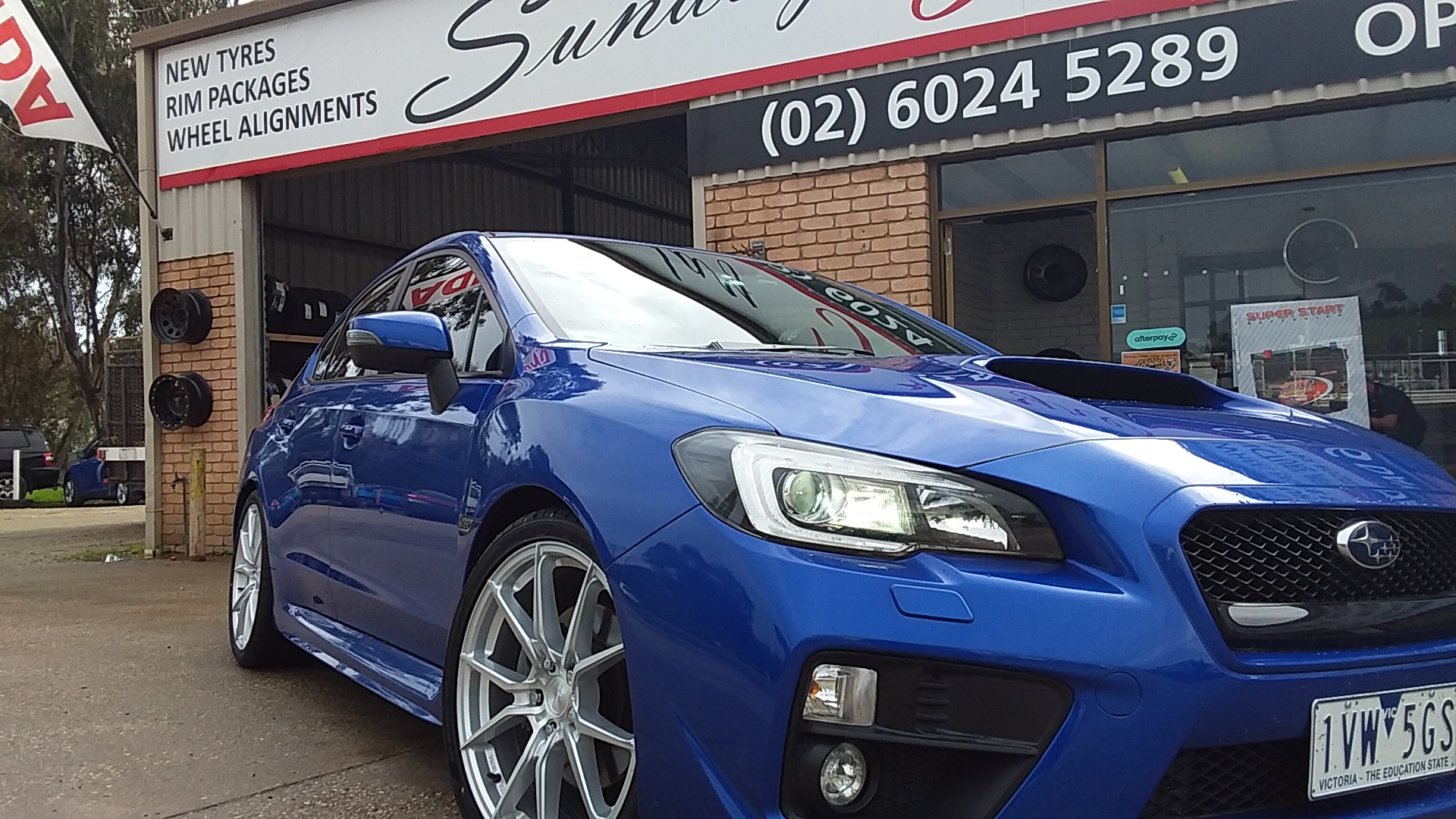 Blue Subaru WRX on silver alloy wheels outside the Chapple Street workshop